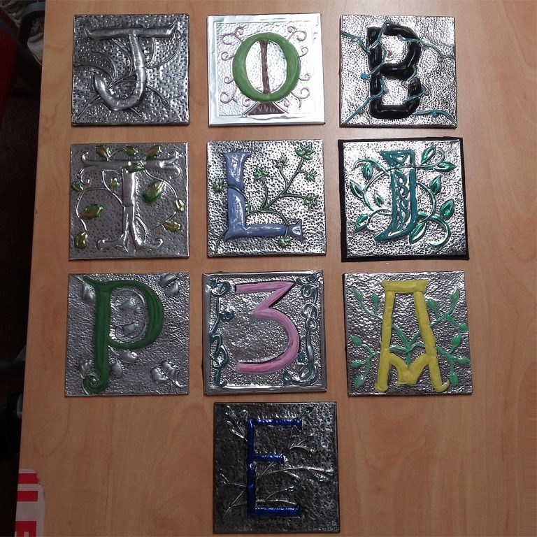 Student showcase: illuminated metal embossed monograms at South Pelaw