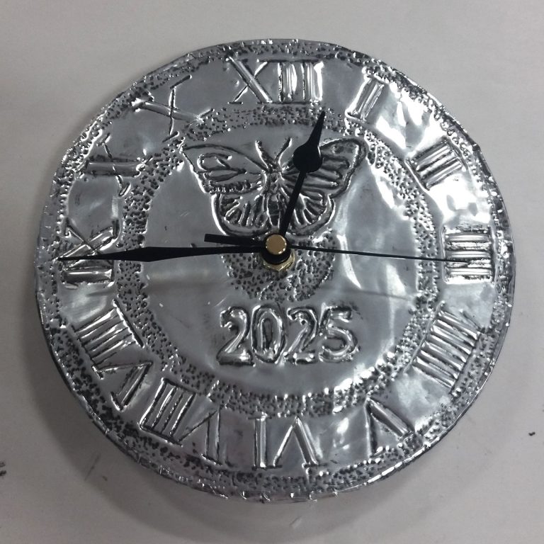 Student showcase: metal embossed clocks with Newcastle Carers