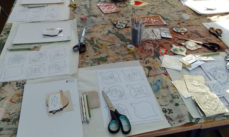 Student showcase: metal embossed Christmas tree ornaments at Land of Oak and Iron