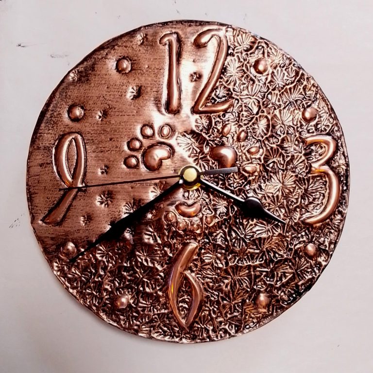 Student showcase: copper embossed clock and house number
